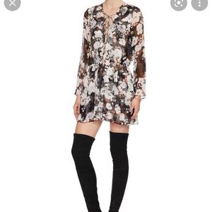 Floral mini dress with long sleeves and lace up neckline
